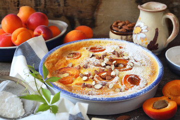 Apricot clafoutis (flan) with almonds, icing sugar dressing