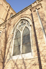 Small neogothic window on Lourdes Basilica's wall