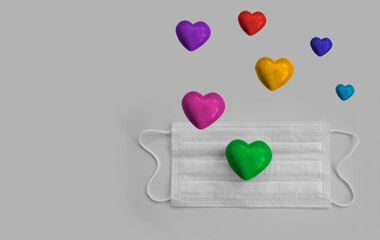 medical mask, heart on a colored background