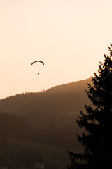 sunset in the mountains with rogalo