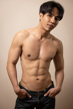 Asian young handsome man shirtless with jean
