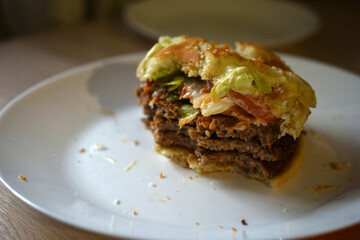 Double juicy meat burger on a white plate