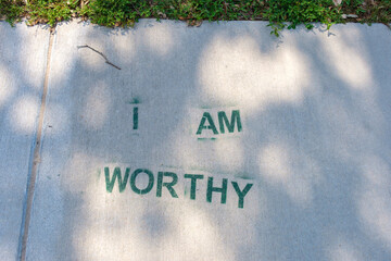 "I Am Worthy" Stenciled on Sidewalk	