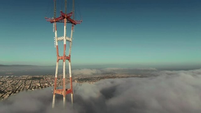 Aerial: Sutro Tower and foggy skyline. San Francisco, USA