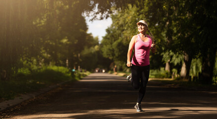 Running woman. Female Runner Jogging during Outdoor Workout in a Park. Beautiful fit Girl. outdoors. Weight Loss