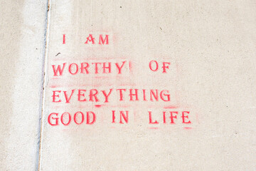 "I Am Worthy of Everything Good in Life" Stenciled on Sidewalk	