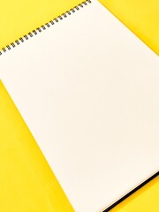 sheet of plain paper on a yellow background