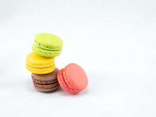 Sweet and Colorful four macaroons stacked togehter on white background