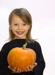 Fototapeta na wymiar little girl with pumpkin