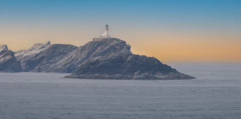 View of Unst Island, the northernmost of the Shetland Islands, Scotland with its lighthouse and...