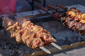 fried meat in large pieces grilled barbecue shahlyk kebab smoke outdoors street food