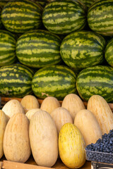 melons watermelons berries fruits on the counter