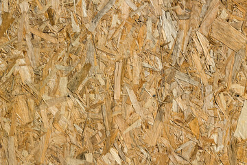 The oriented strand board background light brown color panel pressed sawdust