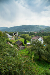 Fototapeta na wymiar View over rural houses and Carpathian mountains in Yaremche, Ukraine.