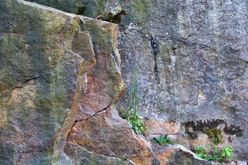 Layers of natural grey and red granite stone