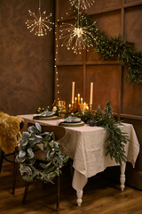 Table served for Christmas dinner, festive setting with decorations
