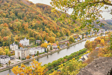 Golden autumn in the resort town of Bad Ems, Germany. View of the Lahn river, city and hills. Autumn colors.