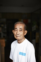 Older man standing in doorway