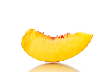 One slice of sweet nectarine, close-up, isolated on white.