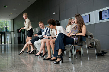 Business people playing musical chairs