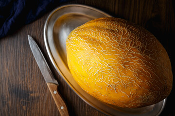 Melon, honey melon on wooden table background.
