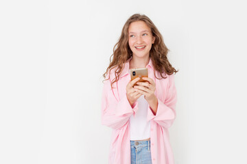 Cheerful young woman girl in white t-shirt with mobile phone