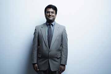 Studio portrait of mid adult male in suit