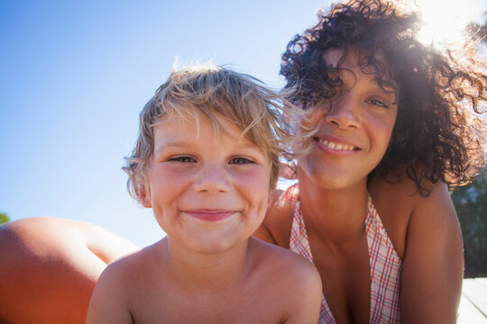 Woman and boy smiling in sun