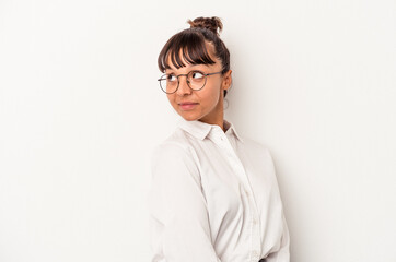 Young mixed race business woman isolated on white background  looks aside smiling, cheerful and pleasant.