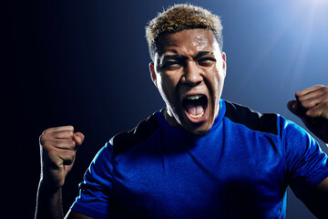Soccer player celebrating © Image Source Limited