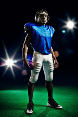 Full length portrait of american football player © Image Source Limited