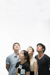 Fototapeta premium Young adults looking up