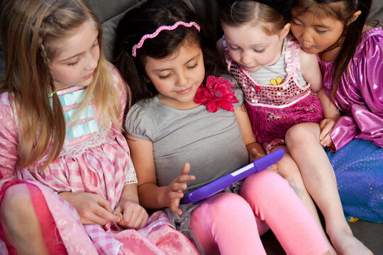 Children looking at digital tablet