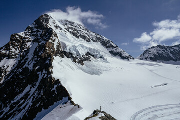 View of Monch and Eiger mountain summit with glacier and clouds from Jungfraujoch sphynx observatory