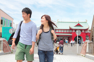 Young couple walking through town
