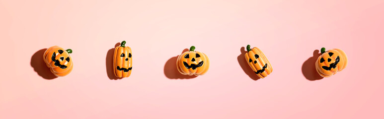 Miniature Halloween pumpkin ghosts - overhead view flat lay