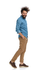 Naklejka premium handsome casual man walking to the side
