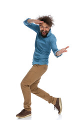casual man messing around and walking to the side