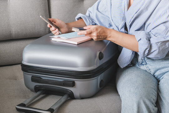 Travel. Online Travel Plans With Covid Passport And Covid Test. Traveling After Quarantine, Lockdown, Covid 19. Staycation.local Travel New Normal.Girl Packs Baggage In Suitcase And Travel Documents