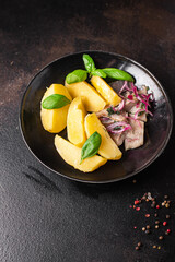 herring and potatoes second course marinated fish onion fresh ready to eat meal snack on the table copy space food background rustic