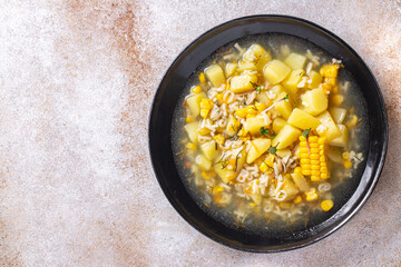 corn soup vegetarian first course vegetable potatoes, pasta alphabet, veggie broth no meat fresh portion meal snack on the table copy space food background rustic vegan 