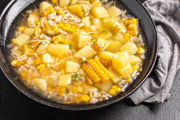 corn soup vegetarian first course vegetable potatoes, pasta alphabet, veggie broth no meat fresh portion meal snack on the table copy space food background rustic vegan 