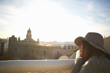 Fototapeta premium Woman enjoying view from terrace, Seville, Spain