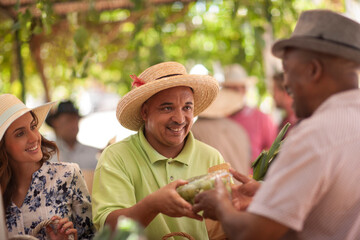 Market trader selling fruits to tourist