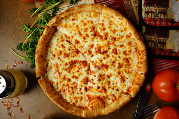 cheese pizza on a wooden table