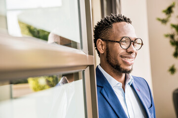 Fototapeta premium Portrait of businessman in office doorway