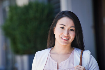 Portrait of businesswoman, outdoors, smiling