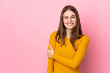 Obraz premium Young caucasian woman isolated on pink background laughing