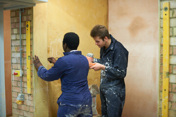 Student learning how to do building work