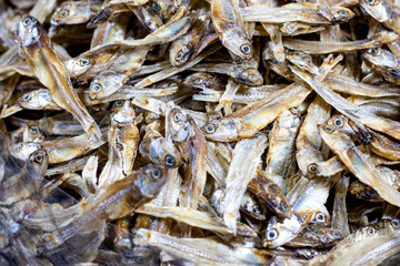 A heap of stored dried fish ​in a seafood market with selective focu